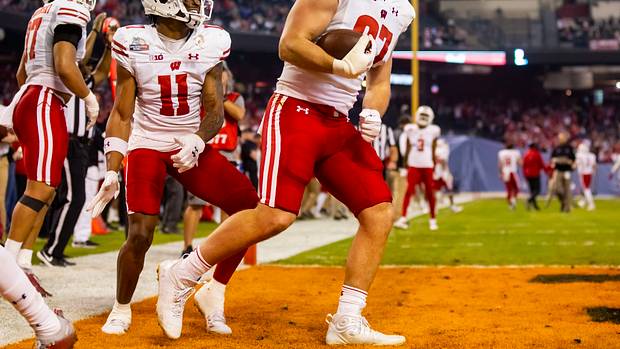 Wisconsin tight end Hayden Rucci celebrates a touchdown reception against Oklahoma State in the Guaranteed Rate Bowl.