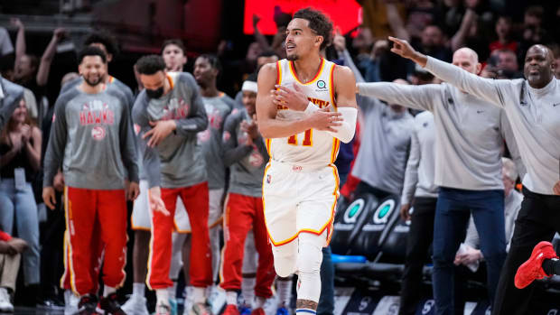 Mar 3, 2022; Atlanta, Georgia, USA; Atlanta Hawks guard Trae Young (11) reacts after making a three point shot against the Chicago Bulls during the second half at State Farm Arena.