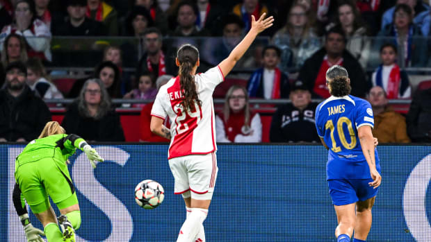 Chelsea forward Lauren James pictured (right) scoring a goal in her side's 3-0 win at Ajax in the first leg of their UEFA Women's Champions League quarter-final in March 2024