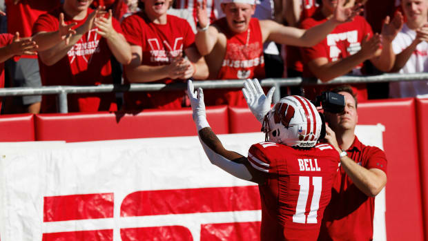 Wisconsin wide receiver Skyler Bell celebrates a touchdown with the student section.