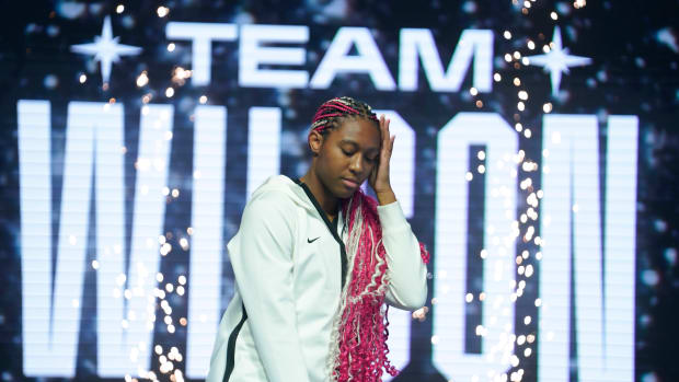 Aliyah Boston poses on stage during player introductions prior to the 2023 WNBA All-Star Game.