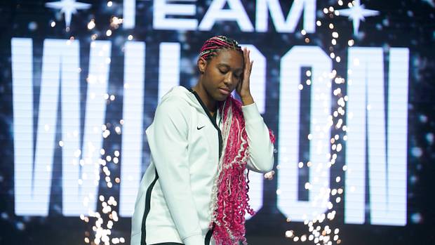 Aliyah Boston poses on stage during player introductions prior to the 2023 WNBA All-Star Game.
