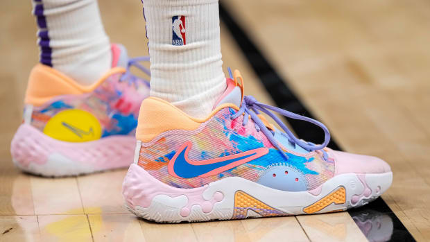 View of Kevin Hueter's pink and blue Nike PG 6 shoes.
