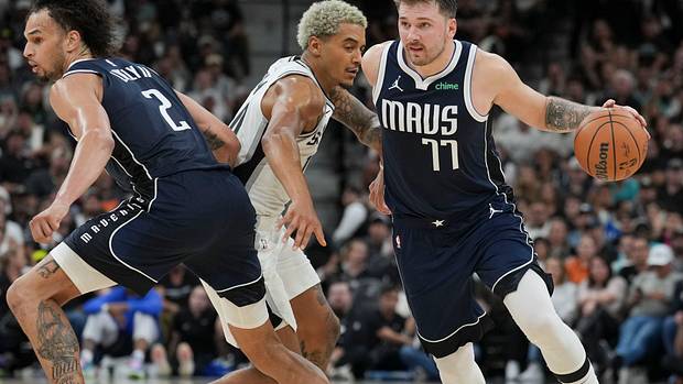 Luka Doncic and Dereck Lively II execute a pick-and-roll in the Dallas Mavericks' win over the San Antonio Spurs.