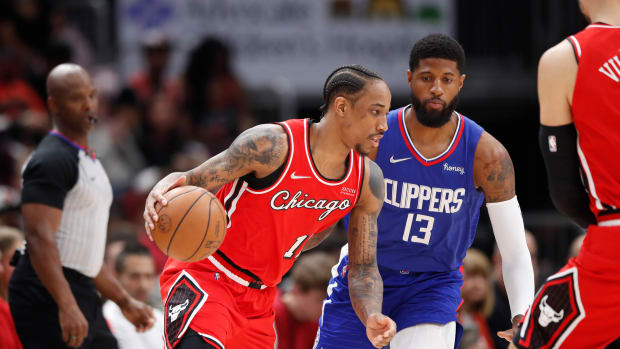 Mar 31, 2022; Chicago, Illinois, USA; Chicago Bulls forward DeMar DeRozan (11) drives to the basket against LA Clippers guard Paul George (13) during the first half at United Center