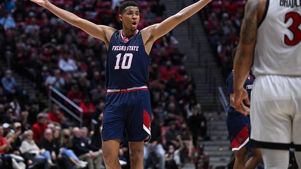 Fresno State Bulldogs forward Orlando Robinson (10) reacts after an offensive goaltending call on the Bulldogs during the second overtime against the San Diego State Aztecs at Viejas Arena.