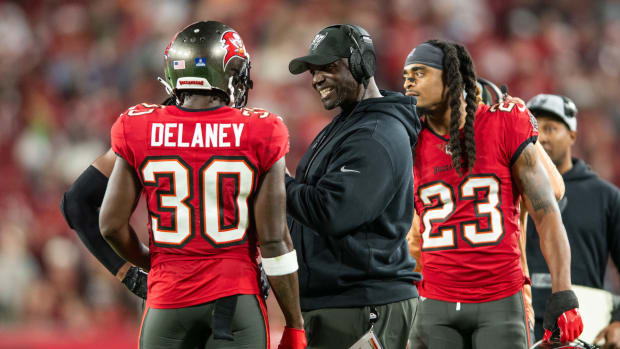 Tampa Bay Buccaneers head coach Todd Bowles talks with defensive back Dee Delaney (30) against the Jacksonville Jaguars in the fourth quarter at Raymond James Stadium. Mandatory Credit: Jeremy Reper-USA TODAY Sports