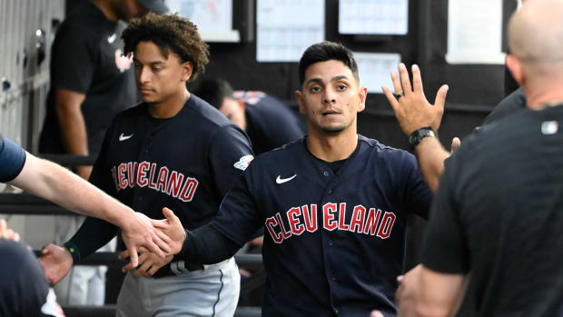 Jul 27, 2023; Chicago, Illinois, USA; Cleveland Guardians second baseman Andres Gimenez (0) celebrates in the dugout after scoring against the Chicago White Sox during the third inning at Guaranteed Rate Field. Mandatory Credit: Matt Marton-USA TODAY Sports