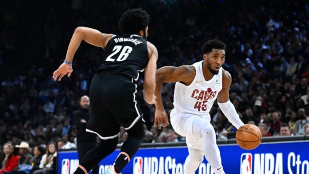 Jan 11, 2024; Paris, FRANCE; Cleveland Cavaliers guard Donovan Mitchell (45) drives to the basket against Brooklyn Nets guard Spencer Dinwiddie (26) in the NBA Paris Game at AccorHotels Arena. Mandatory Credit: Alexis Reau/Presse Sports via USA TODAY Sports