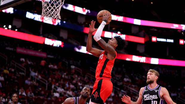 Rockets guard Jalen Green makes a layup against the Sacramento Kings during the first quarter at Toyota Center.