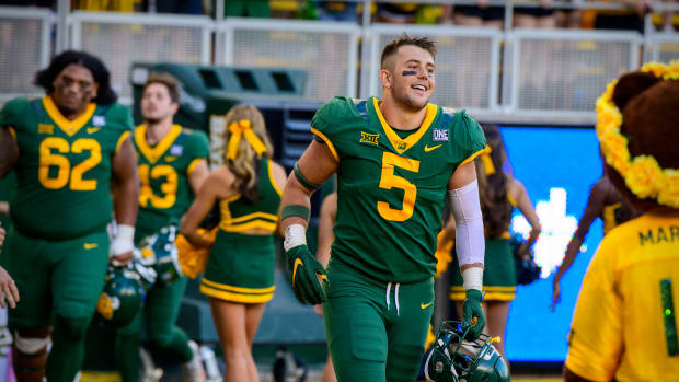 Oct 16, 2021; Waco, Texas, USA; Baylor Bears linebacker Dillon Doyle (5) celebrates the win over the Brigham Young Cougars at McLane Stadium. Mandatory Credit: Jerome Miron-USA TODAY Sports