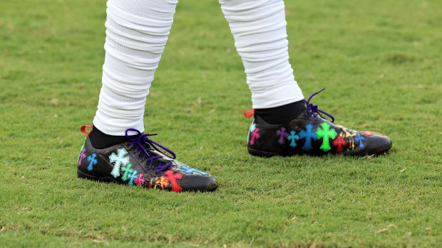 Side view of Odell Beckham Jr.'s black, blue, and green cleats.