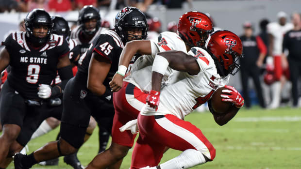 Texas Tech Red Raiders running back SaRodorick Thompson (4) runs the ball against the North Carolina State Wolfpack during the second half at Carter-Finley Stadium.