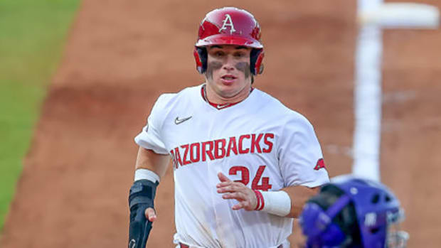 Razorbacks second baseman Peyton Holt comes home during 5-4 win over LSU Tigers on Thursday