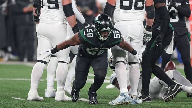 Jets edge rusher Carl Lawson celebrates a defensive play against Jacksonville in 2022