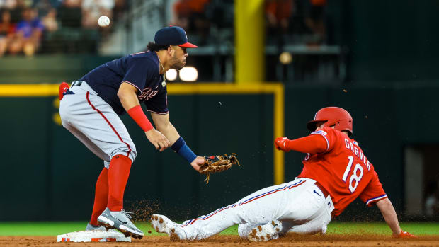 Jun 24, 2022; Arlington, Texas, USA; Washington Nationals shortstop Luis Garcia (2) cannot catch the ball to tag out Texas Rangers designated hitter Mitch Garver (18) at second base during the second inning at Globe Life Field. Mandatory Credit: Kevin Jairaj-USA TODAY Sports