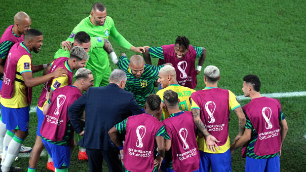 Brazil manager Tite pictured dancing with some of his players after a goal by Richarlison against South Korea at the 2022 FIFA World Cup