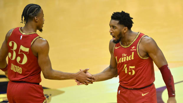Nov 28, 2023; Cleveland, Ohio, USA; Cleveland Cavaliers forward Isaac Okoro (35) and guard Donovan Mitchell (45) celebrate in the fourth quarter against the Atlanta Hawks at Rocket Mortgage FieldHouse.