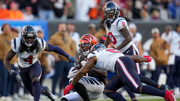 Bengals' Ja'Marr Chase is hit in the head by Houston Texans linebacker Denzel Perryman for a penalty on a reception in the fourth quarter of the NFL Week 10 game between the Cincinnati Bengals.