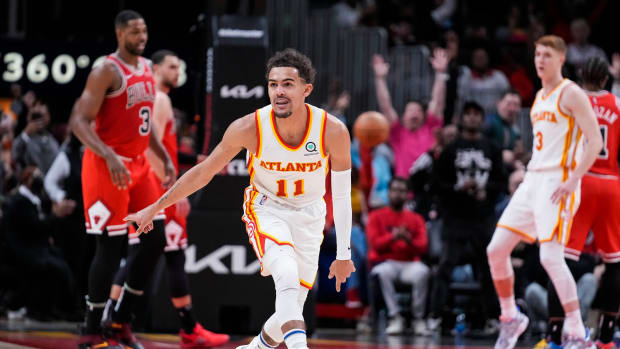 Atlanta Hawks guard Trae Young (11) reacts after making a three point shot against the Chicago Bulls during the second half at State Farm Arena.