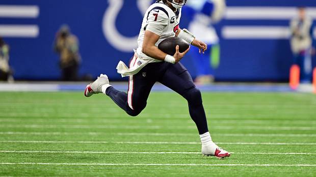 Texans quarterback C.J. Stroud (7) runs the ball against the Indianapolis Colts during the second half at Lucas Oil Stadium.