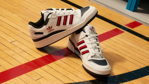 White, red, and black Louisville Cardinals-themed adidas sneakers.