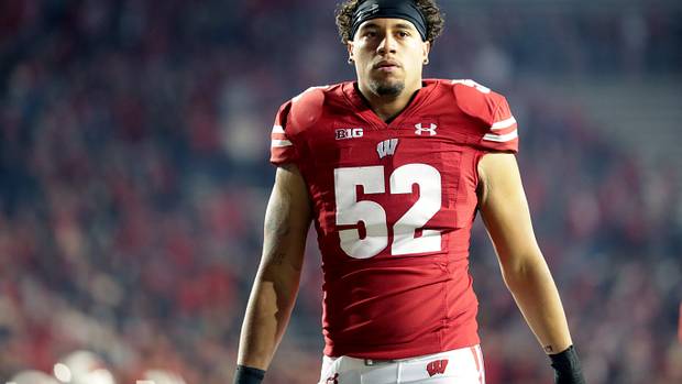 Wisconsin outside linebacker Kaden Johnson walking off the field at Camp Randall Stadium.