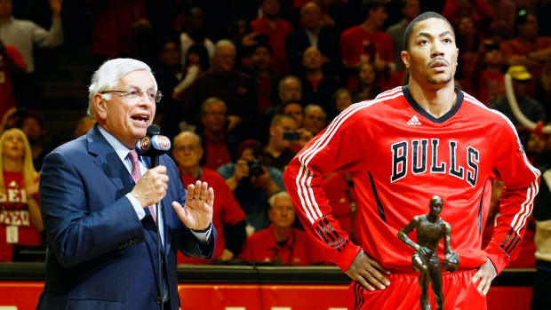 May 4, 2011; Chicago, IL, USA; NBA commissioner David Stern  presents the MVP trophy to Chicago Bulls point guard Derrick Rose