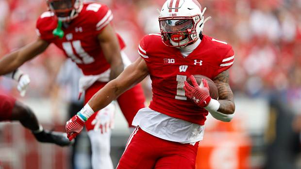 Wisconsin running back Chez Mellusi running with the ball against New Mexico State.