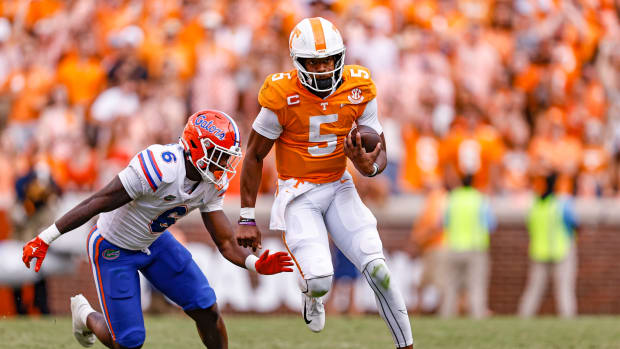 Hendon Hooker escapes a defender during a running play for Tennessee.