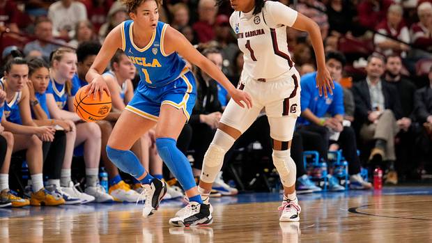 South Carolina Gamecocks guard Zia Cooke defends UCLA Bruins guard Kiki Rice.