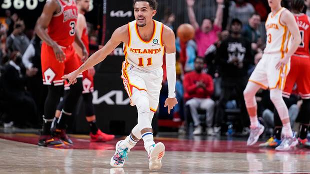 Hawks guard Trae Young reacts after making a shot against the Bulls.