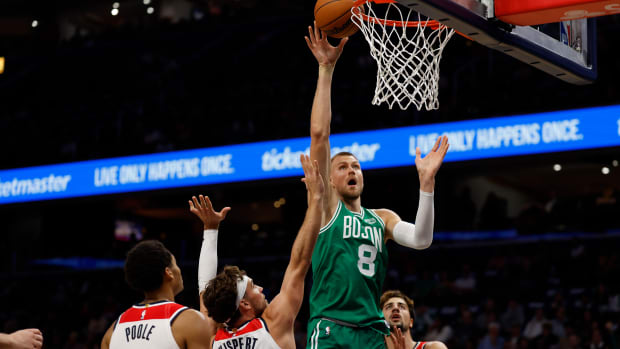 Boston Celtics center Kristaps Porzingis (8) shoots the ball over Washington Wizards forward Corey Kispert (24) in the second quarter at Capital One Arena.