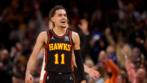 Mar 11, 2022; Atlanta, Georgia, USA; Atlanta Hawks guard Trae Young (11) reacts to a basket by Kevin Huerter (not pictured) during the second half against the LA Clippers at State Farm Arena.