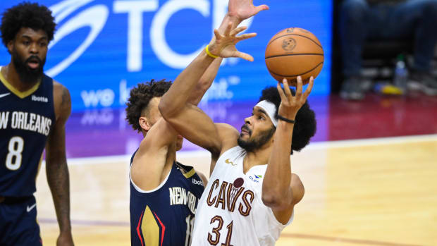 Dec 21, 2023; Cleveland, Ohio, USA; Cleveland Cavaliers center Jarrett Allen (31) shoots the ball as New Orleans Pelicans guard Dyson Daniels (11) defends in the fourth quarter at Rocket Mortgage FieldHouse.