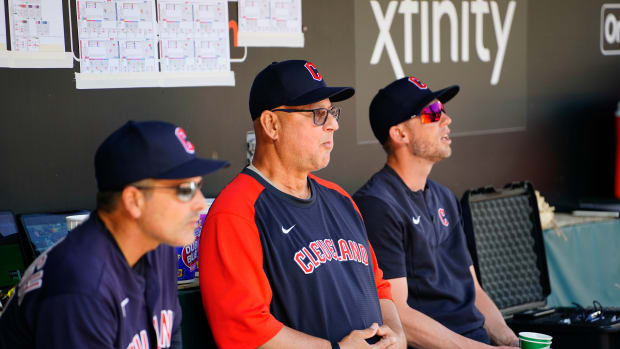 Jun 5, 2022; Baltimore, Maryland, USA; Cleveland Guardians manager Terry Francona (77) sits on the bench with Cleveland Guardians third base coach Mike Sarbaugh (16) and Cleveland Guardians assistant coach Kyle Hudson prior to the game against the Baltimore Orioles at Oriole Park at Camden Yards. Mandatory Credit: Gregory Fisher-USA TODAY Sports