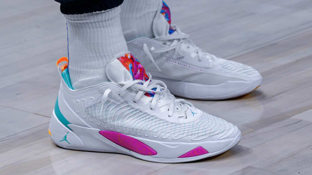 View of Luka Doncic's white and pink shoes.