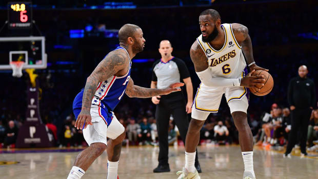 76ers forward P.J. Tucker defends Lakers forward LeBron James.