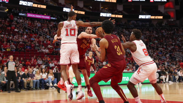Cavaliers forward Georges Niang (20) has his pass intercepted by Houston Rockets forward Jae'Sean Tate (8) in the fourth quarter at Toyota Center.