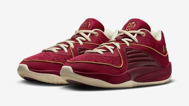 Side view of Kevin Durant's red and gold basketball shoes.