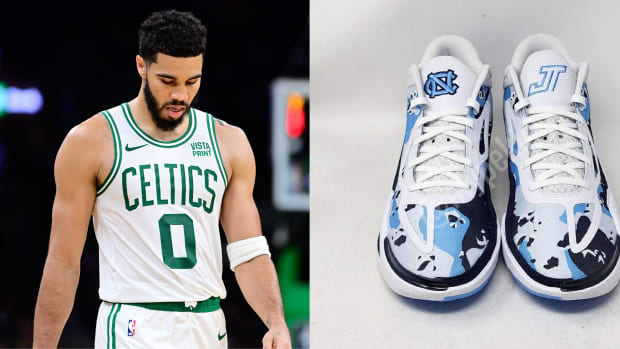 Boston Celtics forward Jayson Tatum next to his blue and white Jordan Brand sneakers.