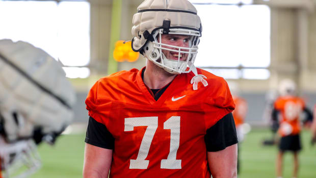 Dalton Cooper (71) runs drills during an Oklahoma State Spring football practice at Sherman E. Smith Training Center in Stillwater, Okla., Tuesday, March 21, 2023.