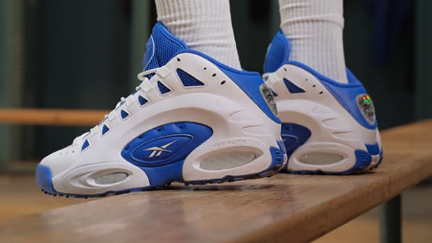 Side view of Emmitt Smith's blue and white Reebok sneakers.