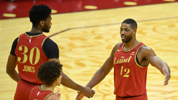 Jan 3, 2024; Cleveland, Ohio, USA; Cleveland Cavaliers center Tristan Thompson (12) celebrates with center Damian Jones (30) and guard Craig Porter (9) in the fourth quarter against the Washington Wizards at Rocket Mortgage FieldHouse. Mandatory Credit: David Richard-USA TODAY Sports