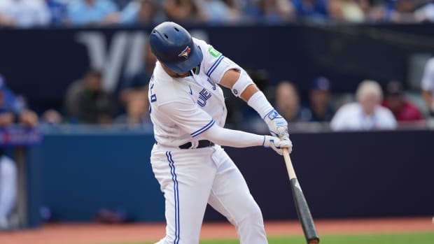 Sep 10, 2023; Toronto, Ontario, CAN; Toronto Blue Jays left fielder Whit Merrifield (15) hits a single against the Kansas City Royals during the eighth inning at Rogers Centre. Mandatory Credit: Nick Turchiaro-USA TODAY Sports  