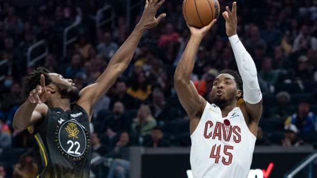 Cleveland Cavaliers guard Donovan Mitchell (45) shoots the basketball against Golden State Warriors forward Andrew Wiggins (22) during the second quarter at Chase Center.
