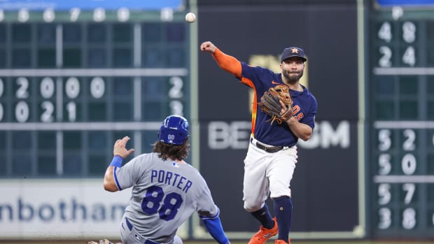 Sep 24, 2023; Houston, Texas, USA; Kansas City Royals catcher Logan Porter (88) is out at second base as Houston Astros second baseman Jose Altuve (27) throws to first base to complete a double play during the seventh inning at Minute Maid Park. Mandatory Credit: Troy Taormina-USA TODAY Sports  