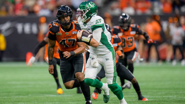 Aug 26, 2022; Vancouver, British Columbia, CAN; BC Lions defensive tackle Sione Teuhema (47) pursues Saskatchewan Roughriders quarterback Cody Fajardo (7) in the firs half at BC Place. Mandatory Credit: Bob Frid-USA TODAY Sports  