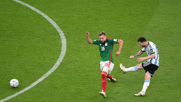 Lionel Messi pictured (right) scoring for Argentina against Mexico at the 2022 FIFA World Cup in Qatar