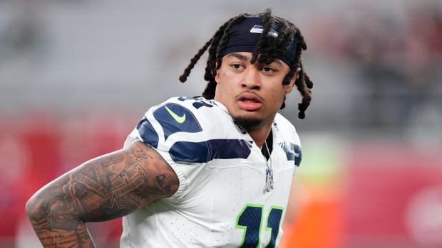 Seattle Seahawks wide receiver Jaxon Smith-Njigba (11) warms up prior to facing the Arizona Cardinals at State Farm Stadium.